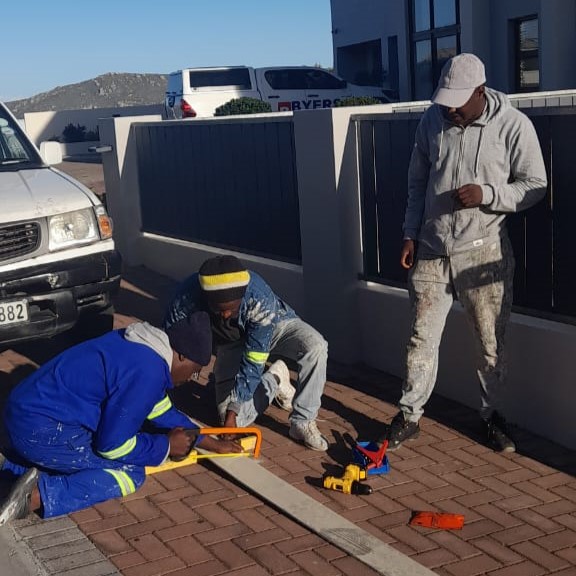 Assured home painters and construction working on site in lagebaan