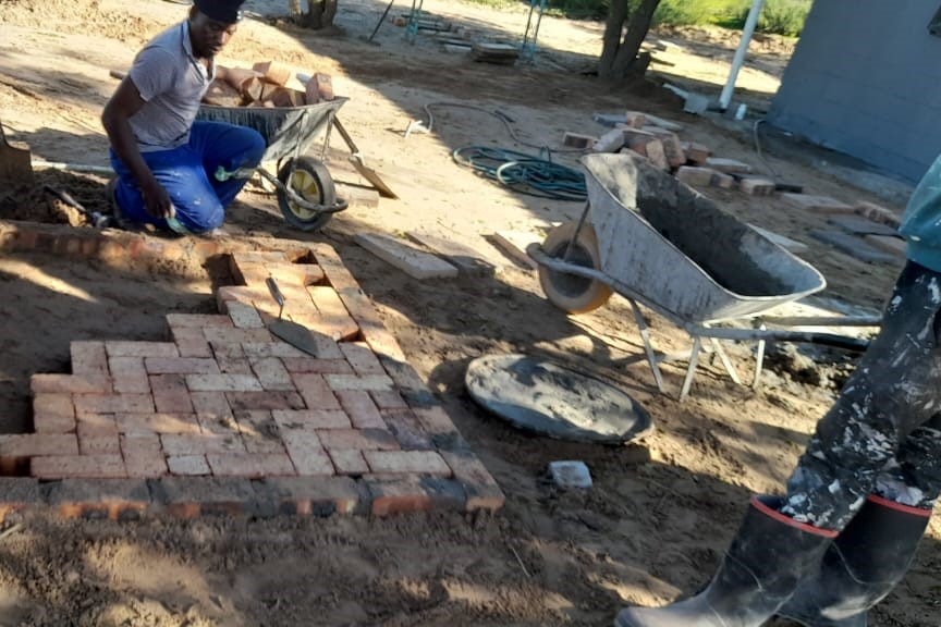 Assured home painters and construction working on site